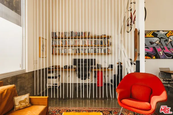 a view of a bedroom with a bed and a couch