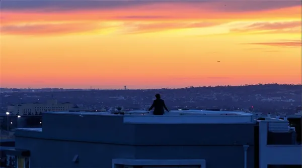 a view of a brick house next to a yard