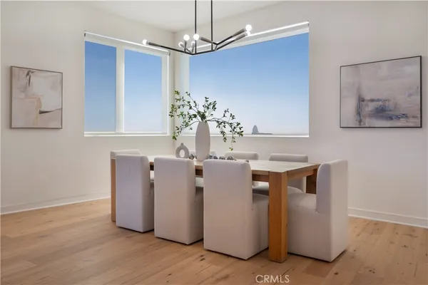 a view of kitchen with stainless steel appliances granite countertop cabinets and wooden floor