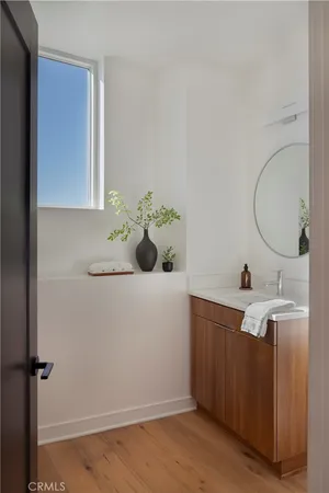 a view of hallway with stairs and wooden floor