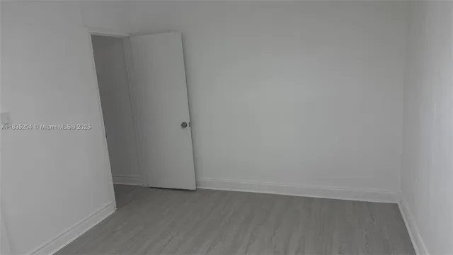 a view of a bathroom from a hallway