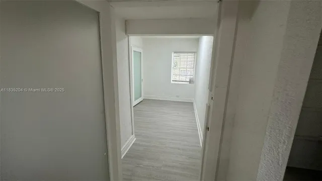 a view of a room that has a window in it