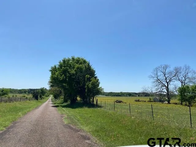 a view of a lake with a big yard