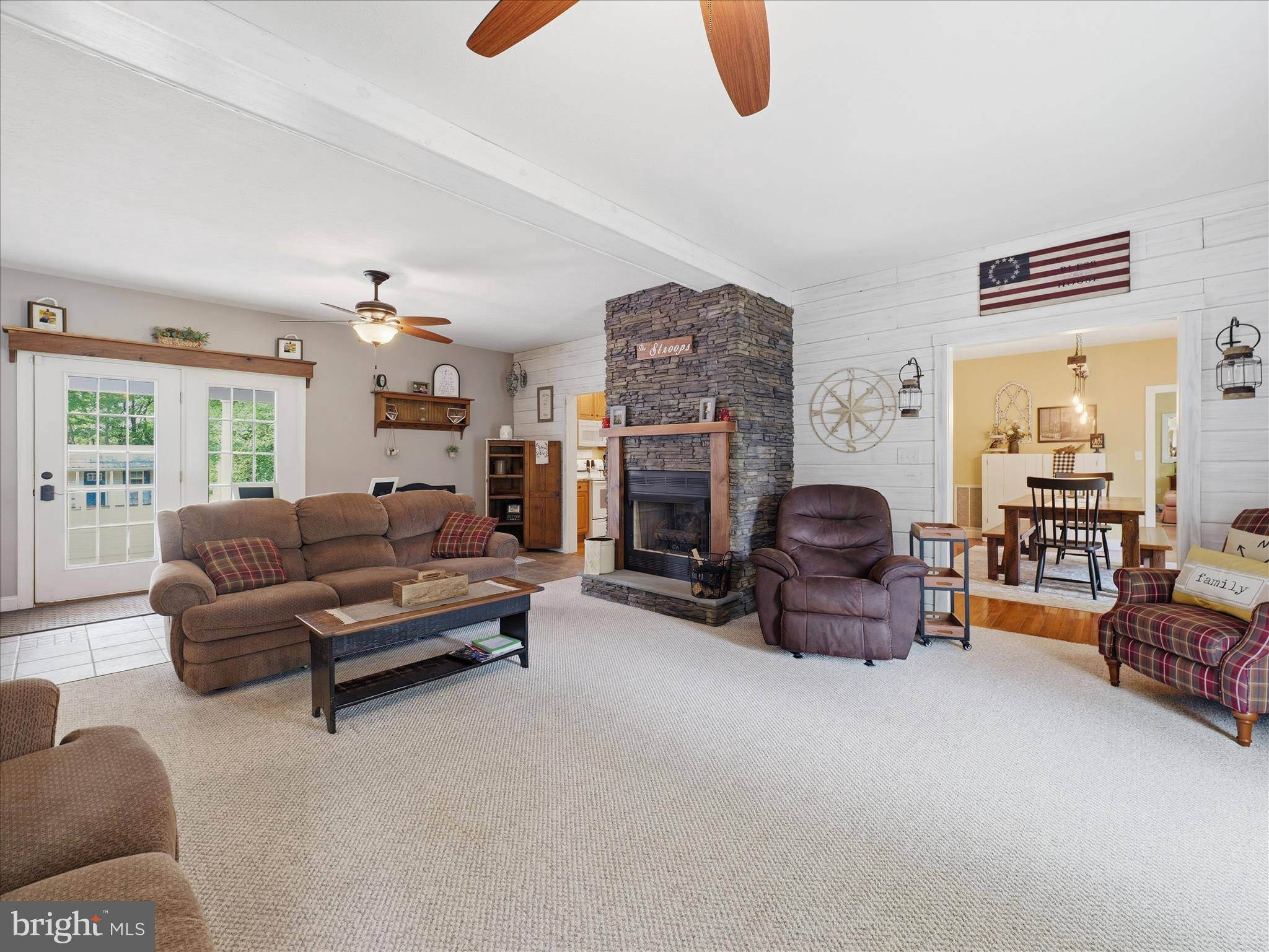 726 Doe Run Road Inwood, WV 25428 - Photo 40 of 68 a living room with furniture and a fireplace