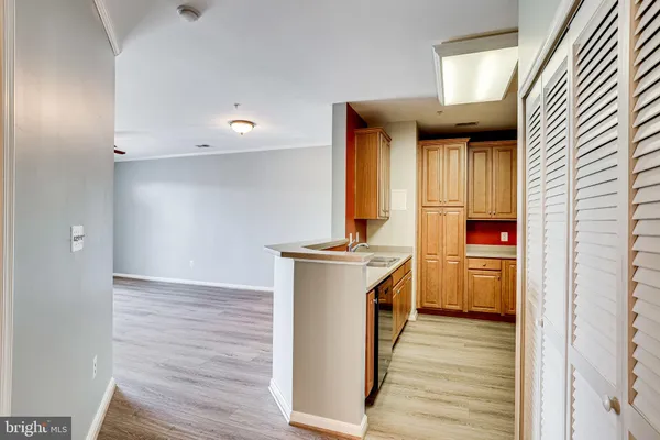 a kitchen with stainless steel appliances a stove a sink dishwasher and a refrigerator