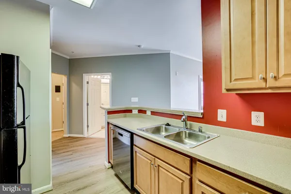 a kitchen with a stove top oven sink and cabinets