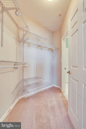 a view of bathroom with a sink mirror and toilet
