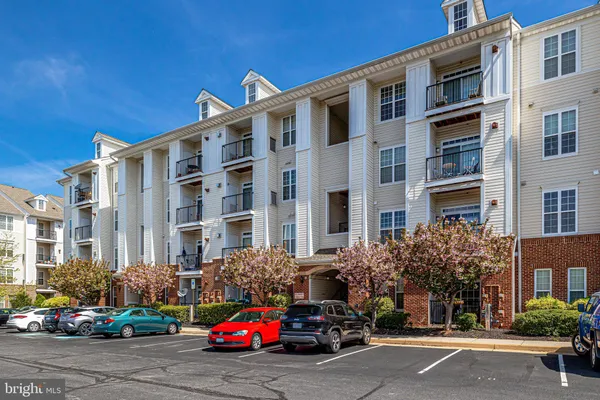 a front view of a building with parking