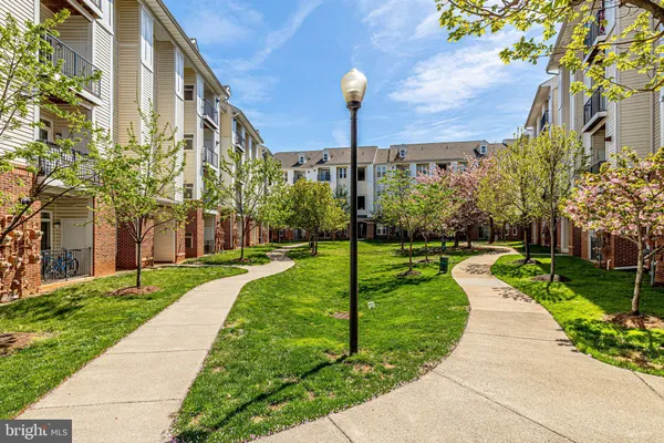 a view of a building with a yard