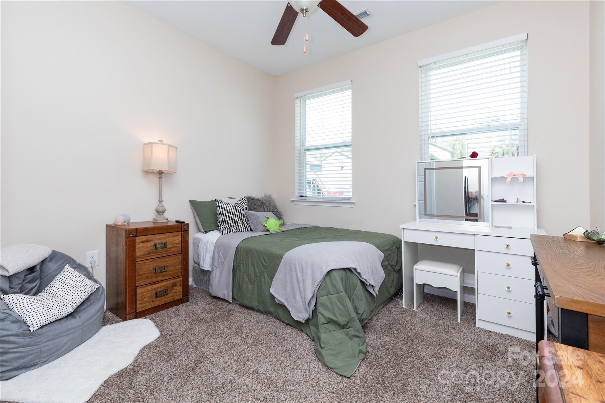 72 Shiloh Road Asheville, NC 28803 - Photo 11 of 15 a bedroom with a bed and a desk