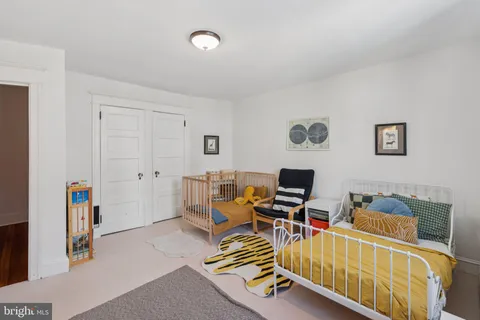 a living room with furniture gym equipment and a flat screen tv