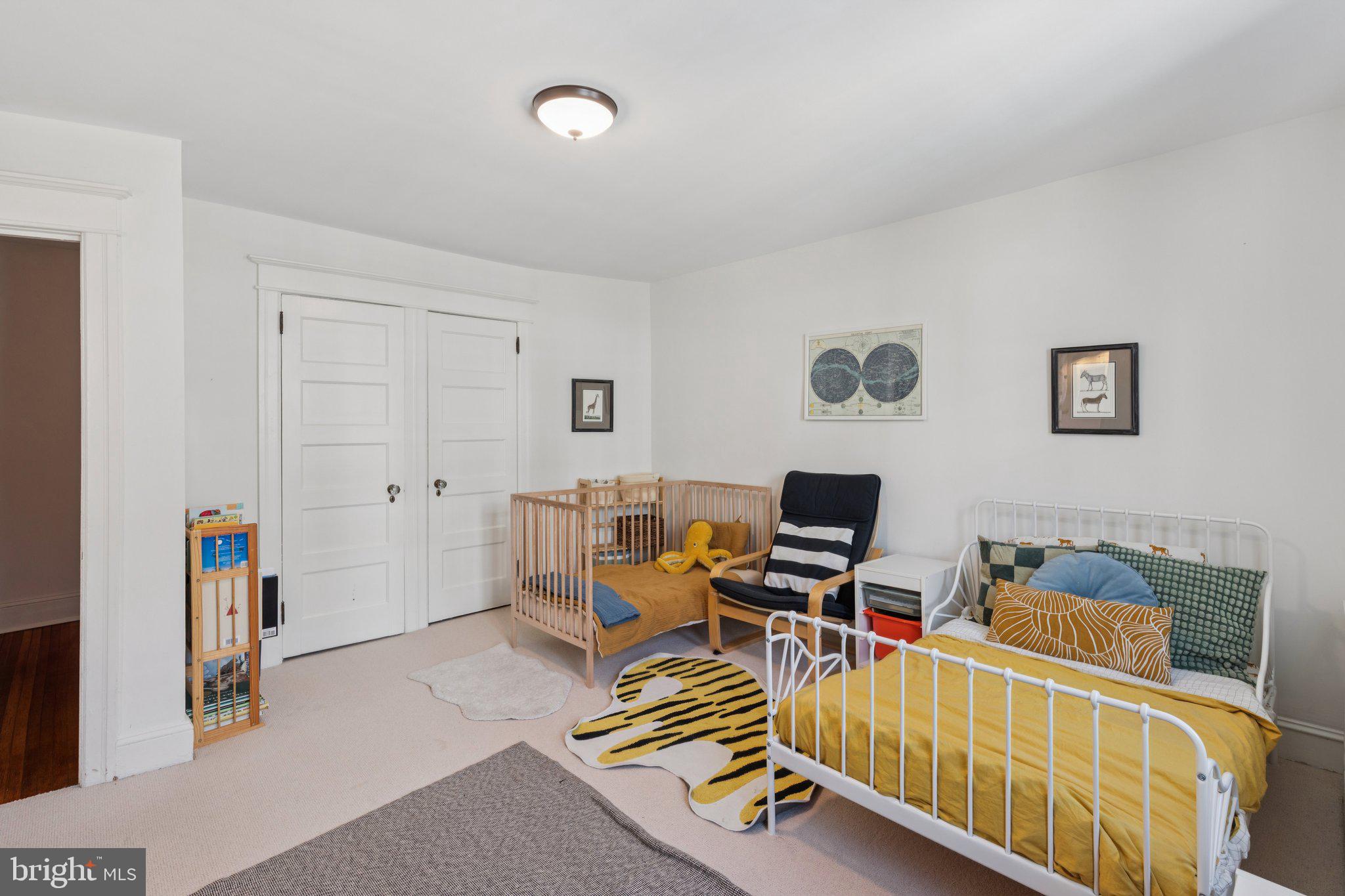 519 Burnham Road Philadelphia, PA 19119 - Photo 14 of 56 a living room with furniture gym equipment and a flat screen tv