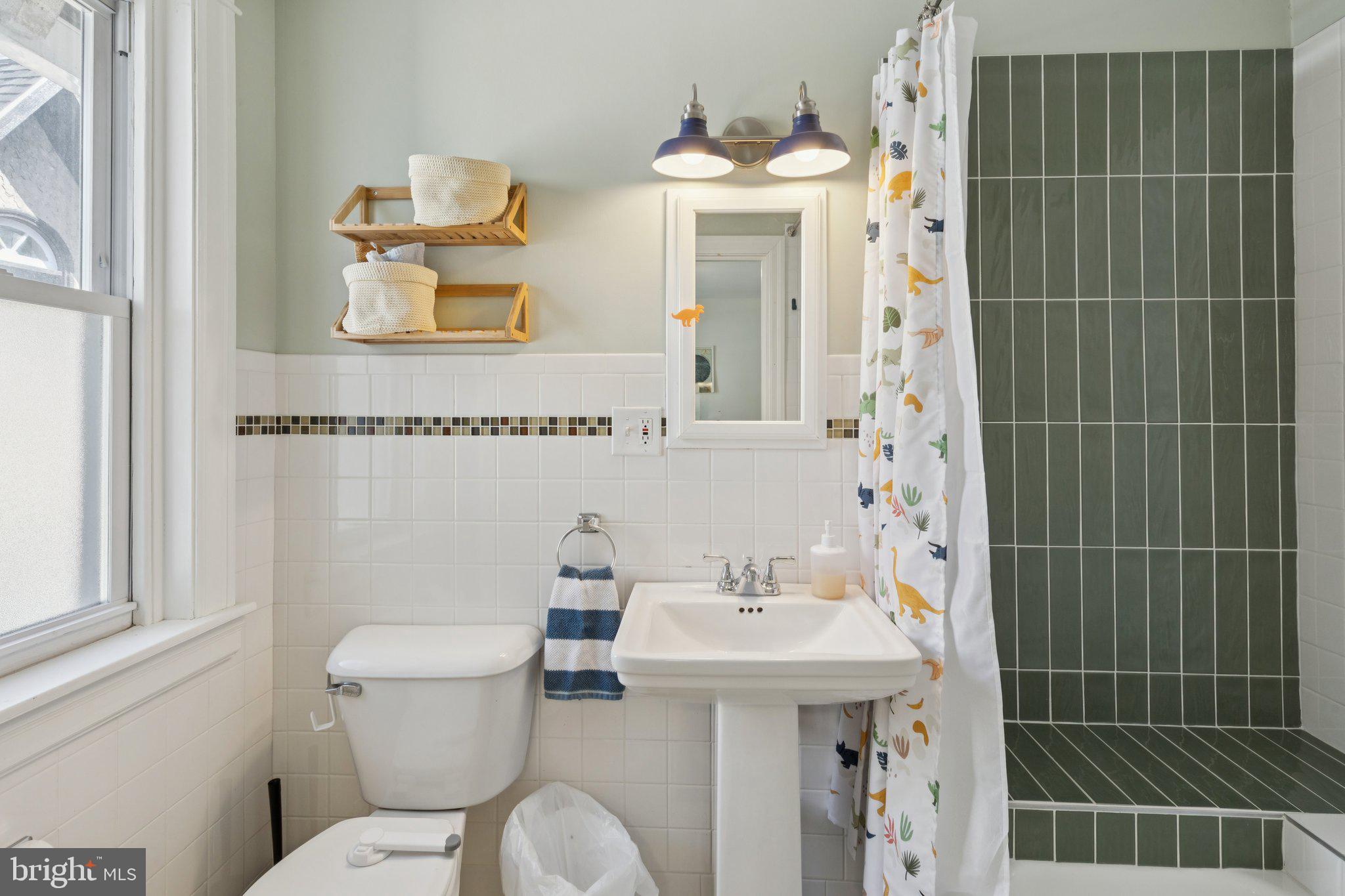 519 Burnham Road Philadelphia, PA 19119 - Photo 16 of 56 a bathroom with a sink a toilet and shower