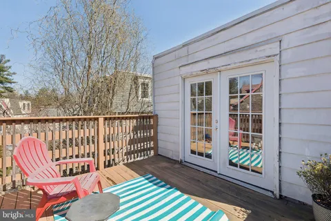 a view of a two chairs in the balcony