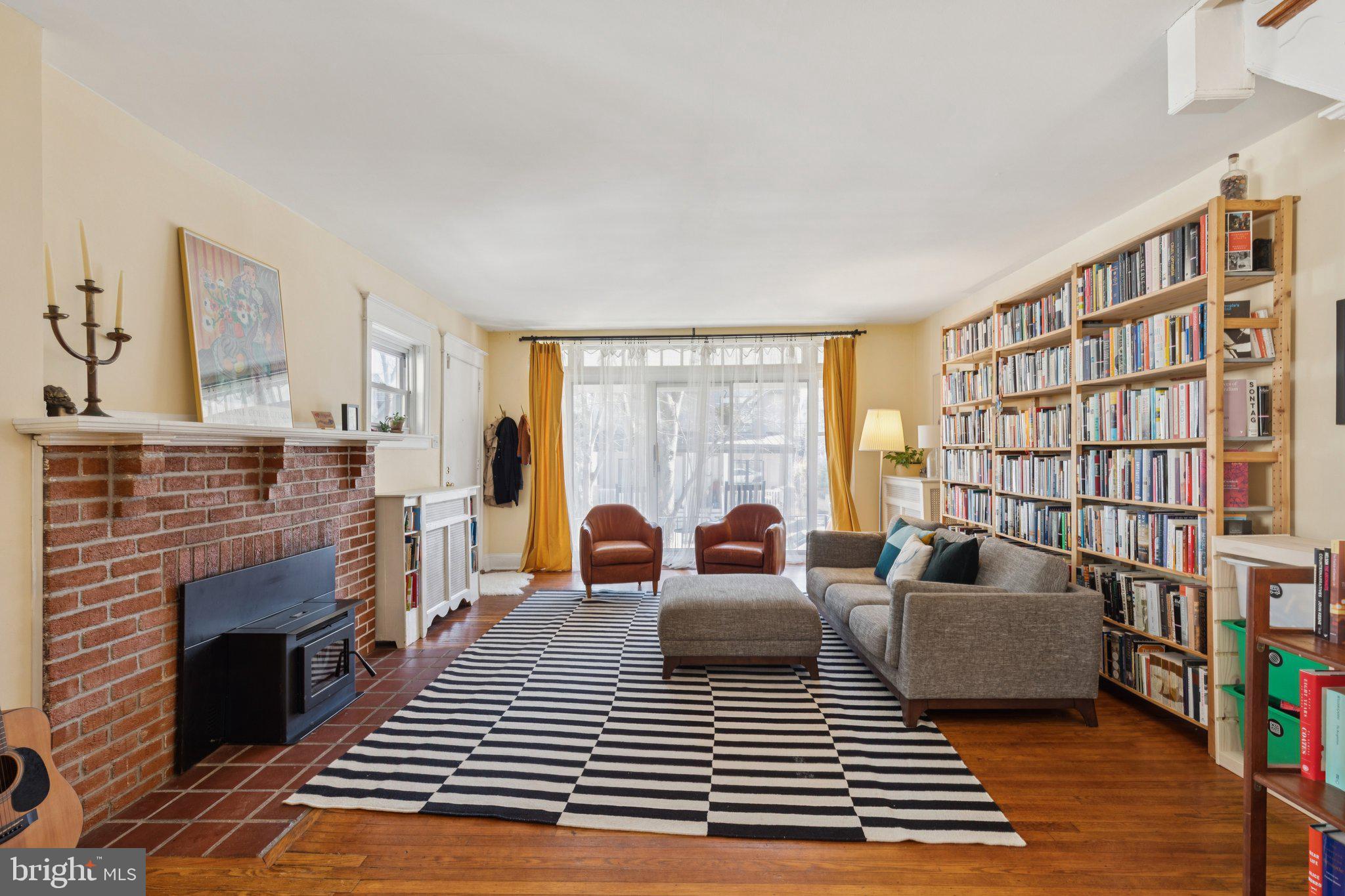 519 Burnham Road Philadelphia, PA 19119 - Photo 27 of 56 a living room with furniture a rug and a fireplace