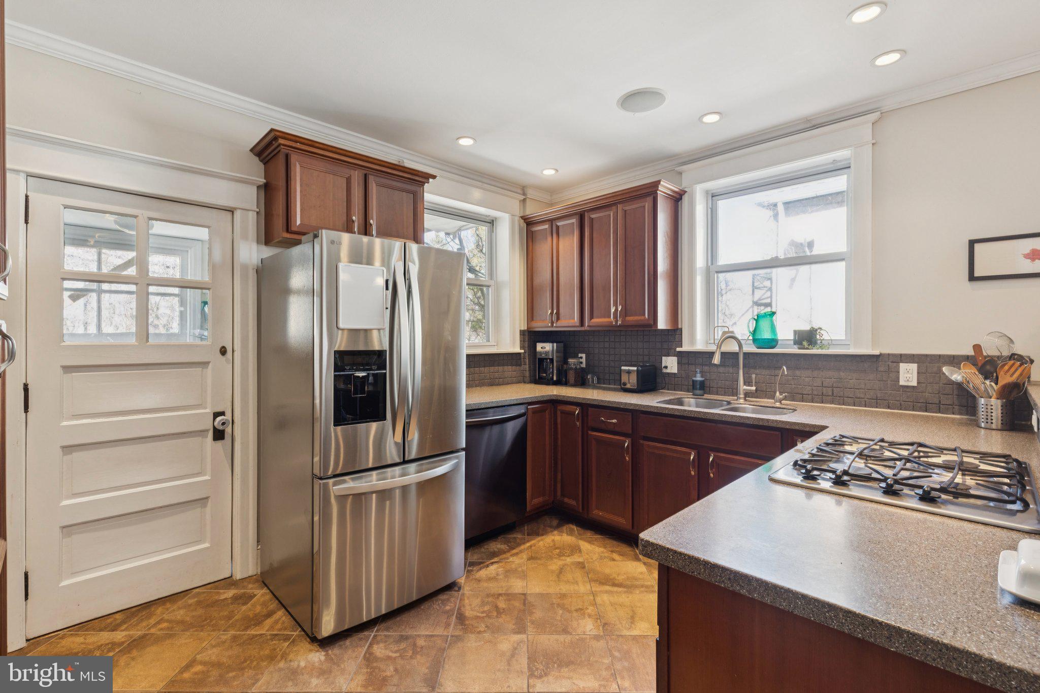 519 Burnham Road Philadelphia, PA 19119 - Photo 31 of 56 a kitchen with a refrigerator stove and sink