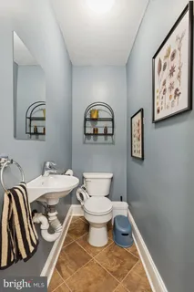 a bathroom with a toilet and a sink