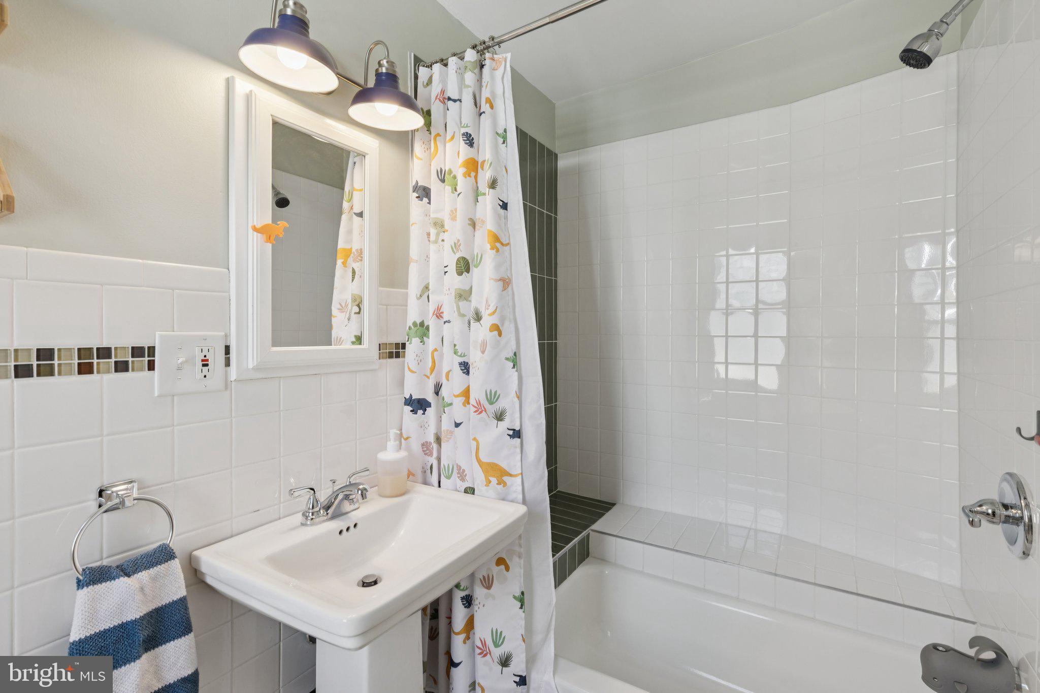 519 Burnham Road Philadelphia, PA 19119 - Photo 39 of 56 a bathroom with a sink a toilet and shower