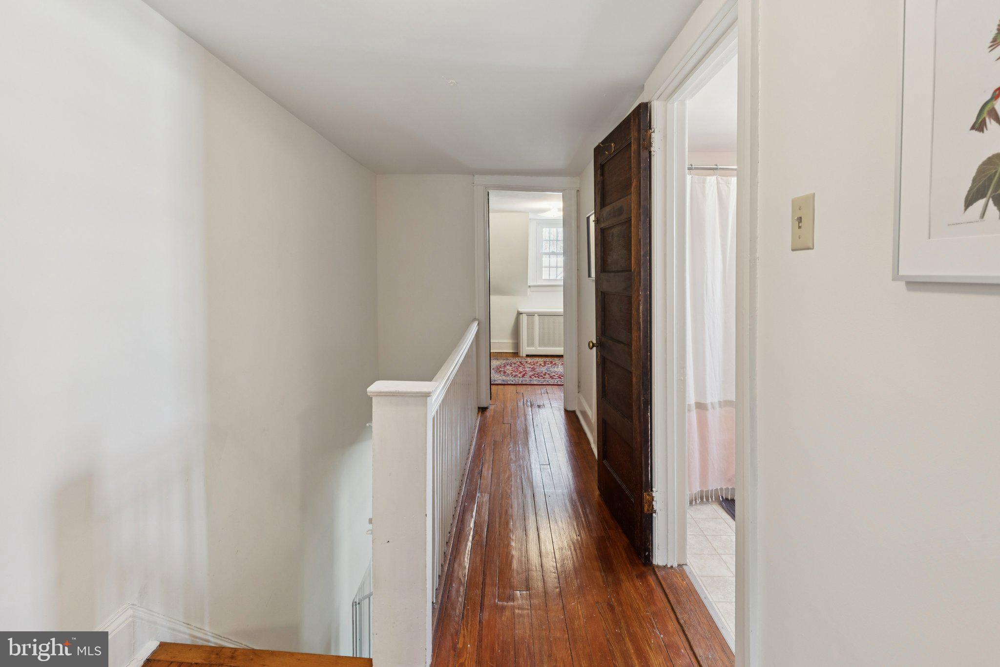 519 Burnham Road Philadelphia, PA 19119 - Photo 41 of 56 a view of a hallway with wooden floor and staircase