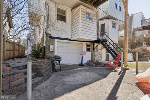 a view of a white building with large windows