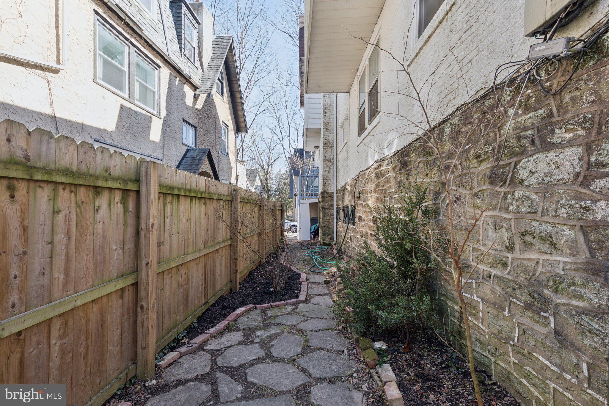 519 Burnham Road Philadelphia, PA 19119 - Photo 55 of 56 a view of a pathway of a house with wooden fence