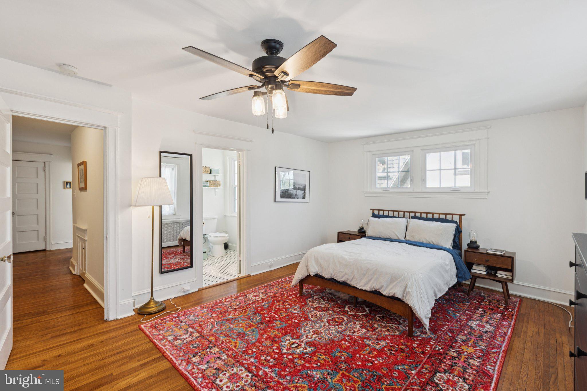 519 Burnham Road Philadelphia, PA 19119 - Photo 10 of 56 a bedroom with a large bed and a chandelier