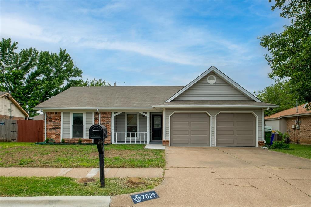 front view of a house and a yard