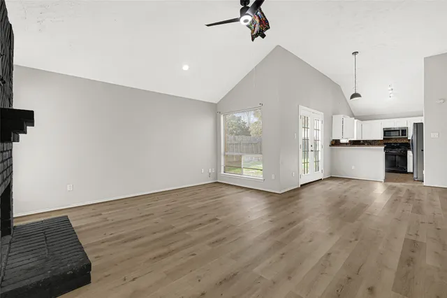 a view of a kitchen with a stove cabinets and wooden floor
