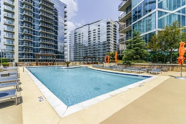 a view of a swimming pool with a lounge chairs