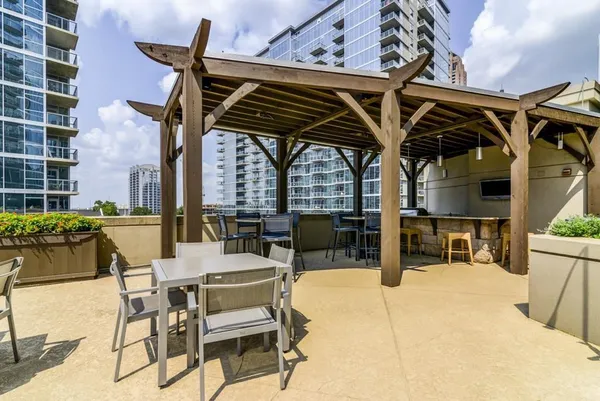 a view of a patio with a table and chairs