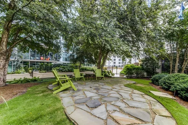 a view of a park with bench and a slide