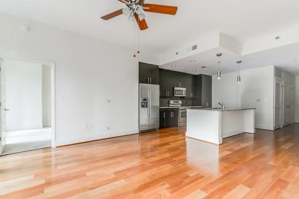 a view of kitchen with microwave and cabinets
