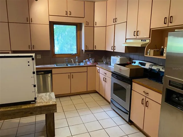 a bedroom with a bed and dresser