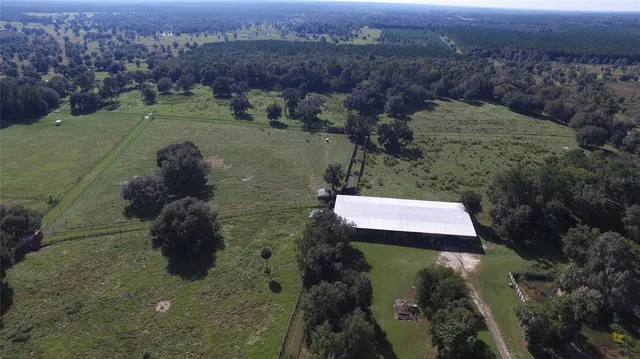 an aerial view of mountain with trees around