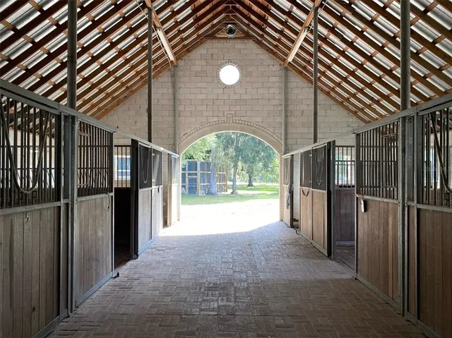 a view of a swimming pool with an outdoor seating