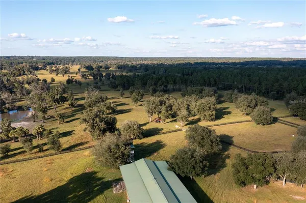 a view of a swimming pool with an outdoor space and seating area