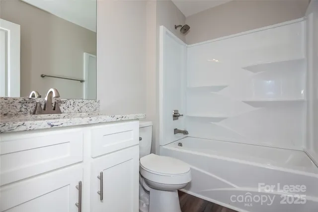 a bathroom with a sink a toilet and a bathtub