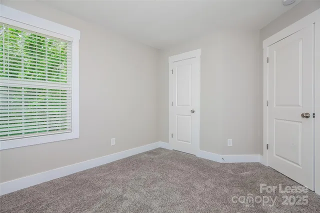 a view of a room that has a window in it