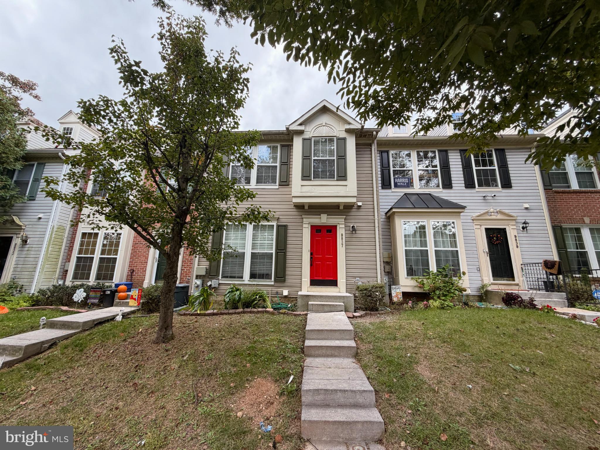 a front view of a house with a yard