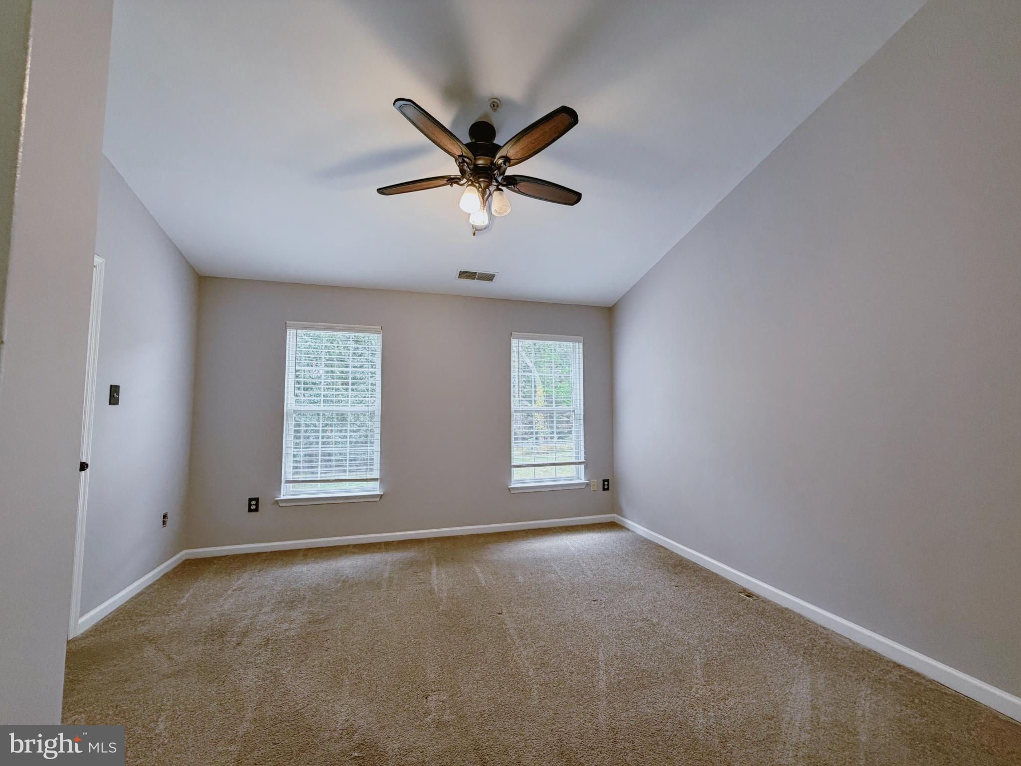 9837 Sherwood Farm Road Owings Mills, MD 21117 - Photo 11 of 27 a view of a livingroom with a ceiling fan and window
