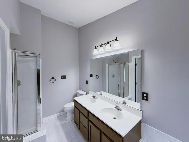 a en suite bathroom with a sink and mirror