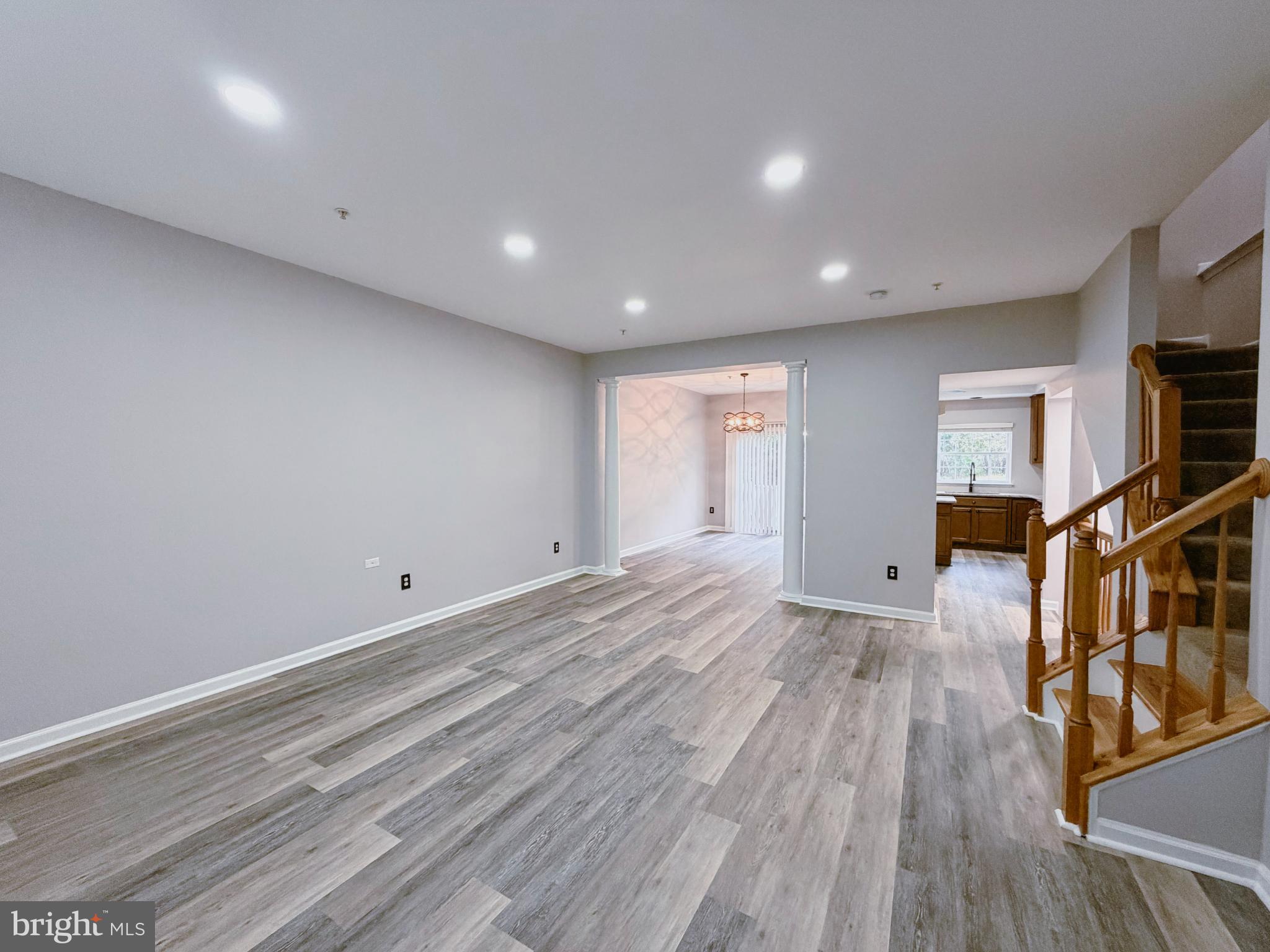 9837 Sherwood Farm Road Owings Mills, MD 21117 - Photo 4 of 27 a view of a room with wooden floor and stairs