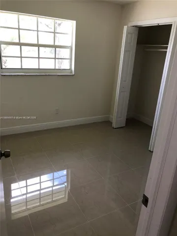 a view of empty room with windows