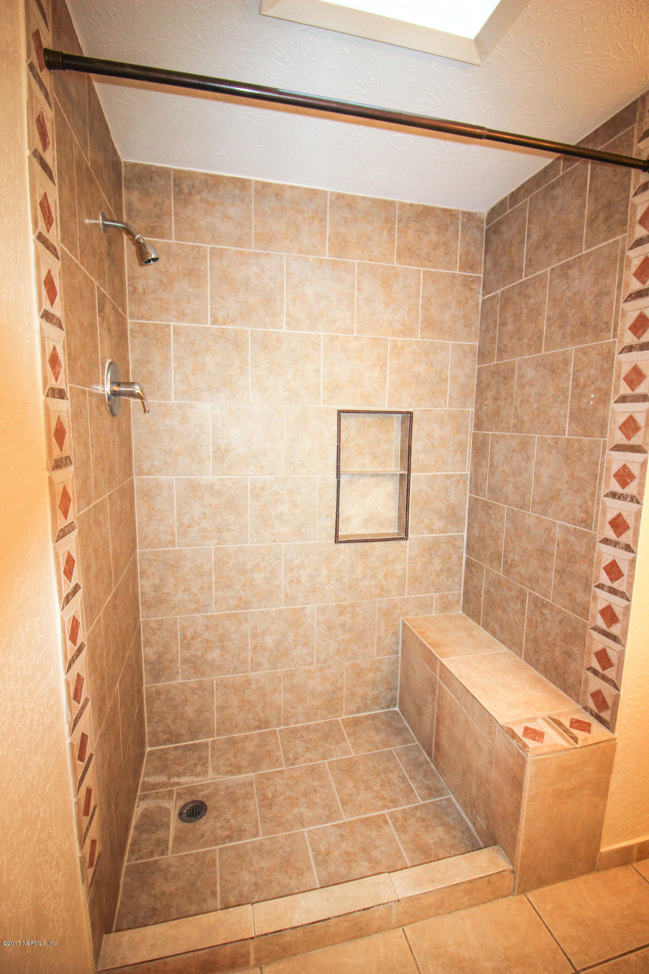 4134 Rogero Road Jacksonville, FL 32277 - Photo 18 of 36 a bathroom with a shower