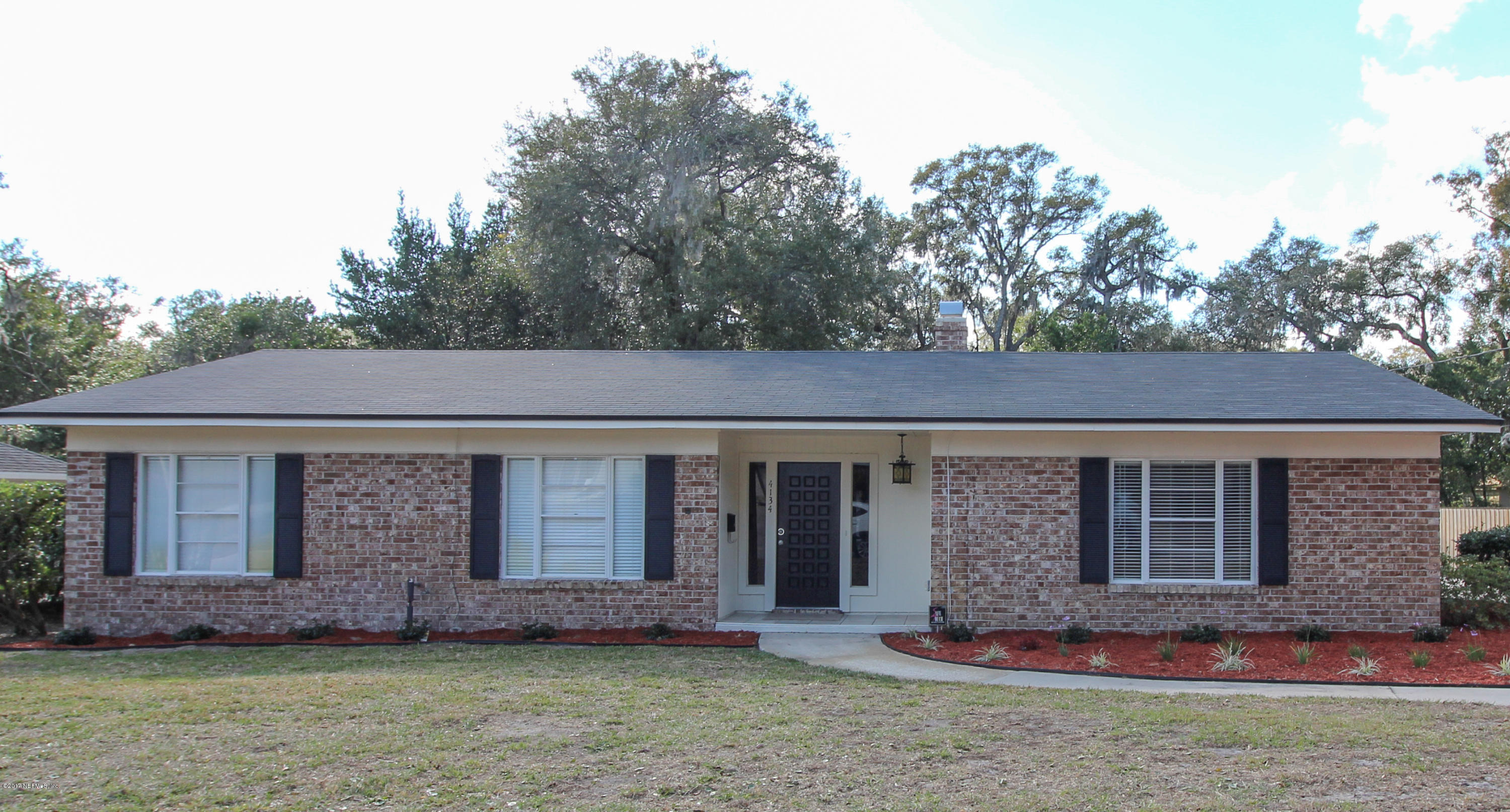 4134 Rogero Road Jacksonville, FL 32277 - Photo 24 of 36 front view of a house with a yard