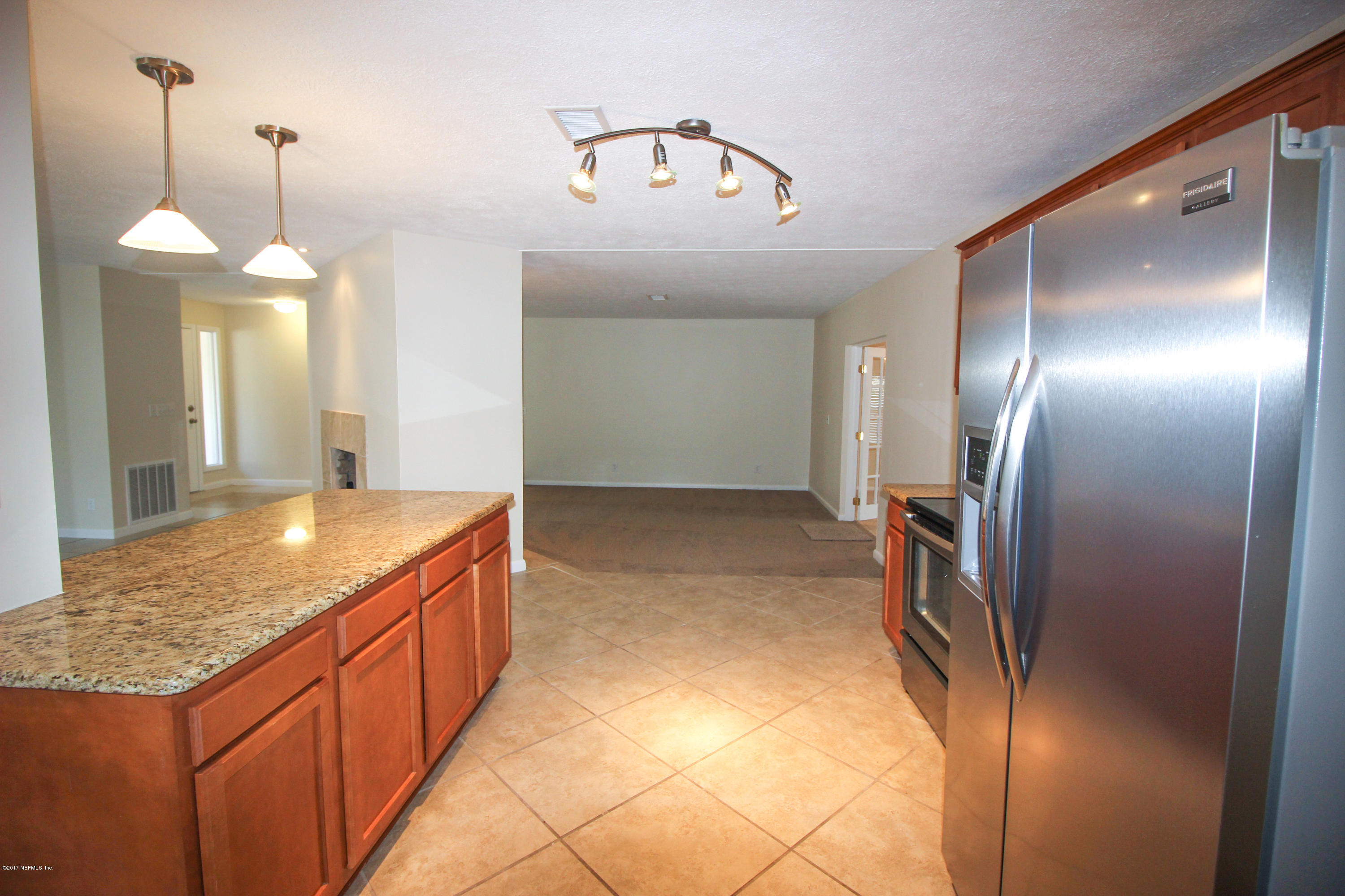 4134 Rogero Road Jacksonville, FL 32277 - Photo 33 of 36 a bathroom with a granite countertop sink and a mirror