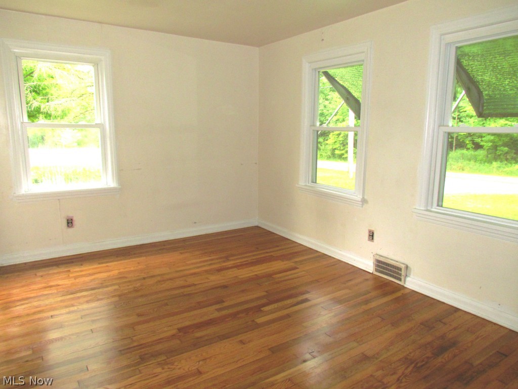 16339 Snow Road Burton, OH 44021 - Photo 9 of 16 First floor bedroom with newly finished hardwood floor