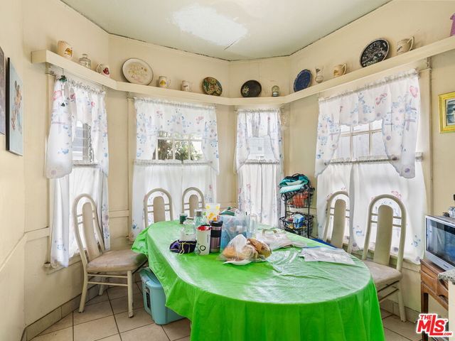 a dining room with furniture window and a fireplace