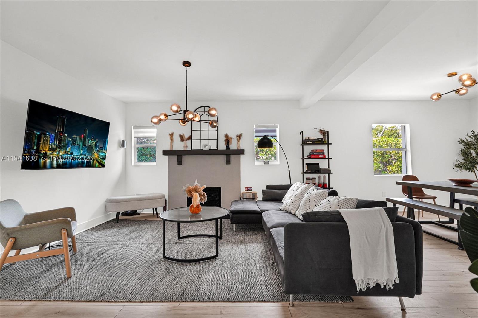 37 Northwest 47th Street Miami, FL 33127 - Photo 12 of 83 a living room with furniture a window and a flat screen tv