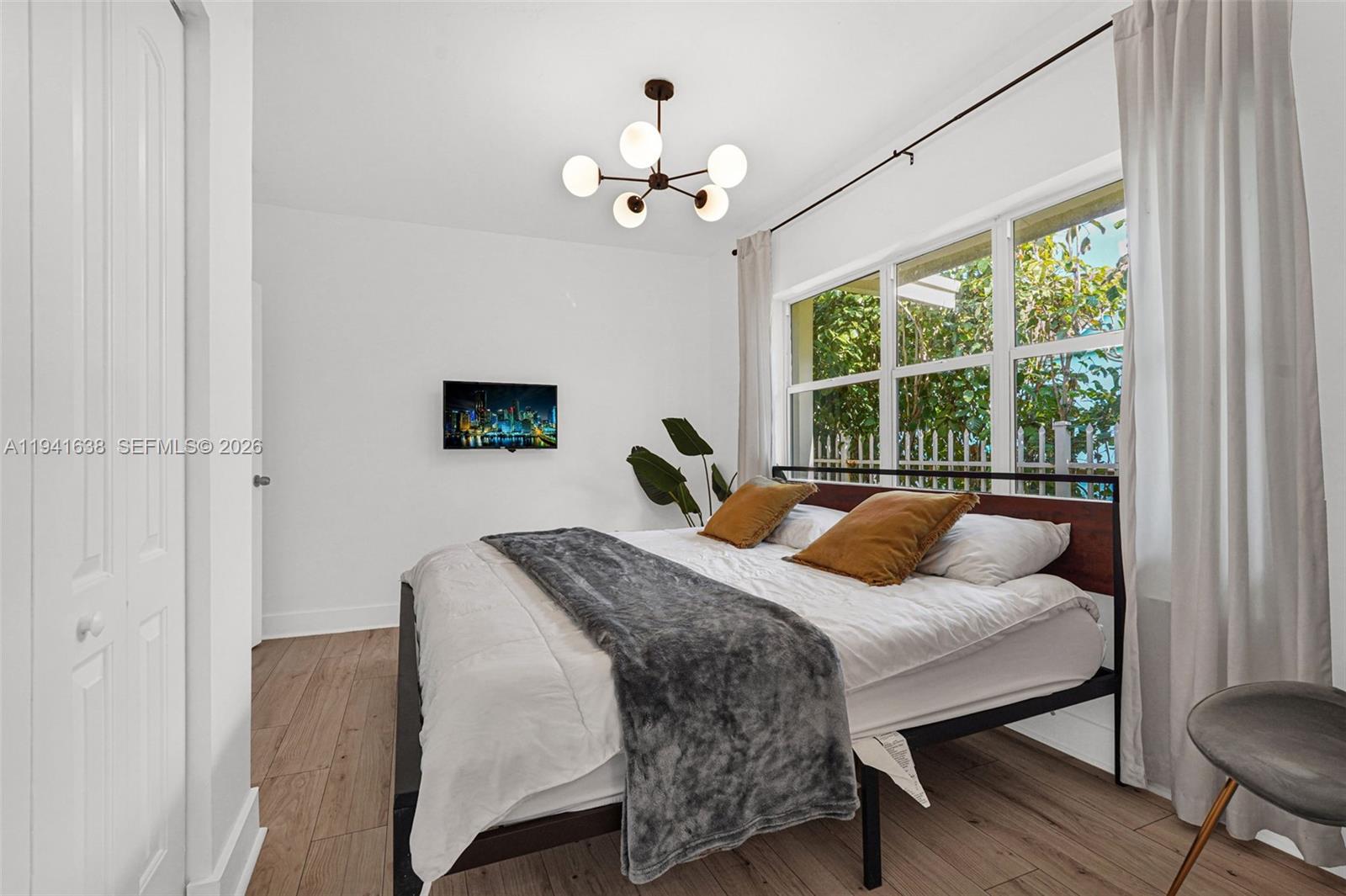 37 Northwest 47th Street Miami, FL 33127 - Photo 14 of 83 a bedroom with a bed and a table